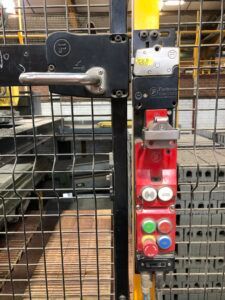 Interlock on mounting plate with forced extracted key, control pod with emergency stop button, and RFID reader used in a brickworks